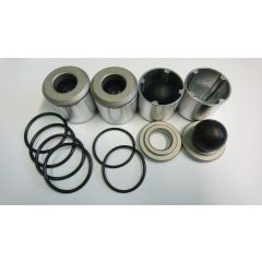 Venttiilisarja Yamadan kalvopumppuun sisältäen neljä metallista sylinteri, yhden pyöreän tiivisteen metallireunuksella.